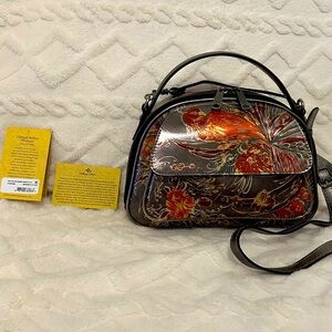 Patricia Nash contemporary crossbody bag. 
Style: Marta  Bowling bag silhouette.